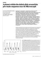 A planet within the debris disk around the pre-main-sequence star AU Microscopii