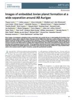 Images of embedded Jovian planet formation at a wide separation around AB Aurigae